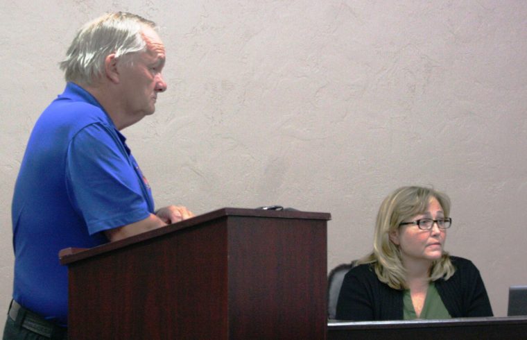 Bronson Fire Chief Dennis Russell and Town Clerk Shirley Miller listen to discussion on planned firehouse.