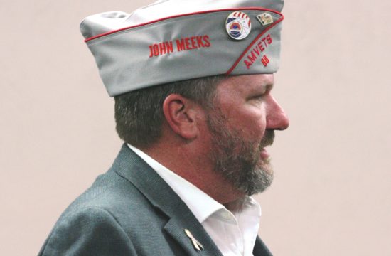 County Commission Chairman John Meeks, representing Sons of Amvets Post 88 in Bronson, receives permission to place wreaths on the graves of veterans at Jim Milton Cemetery.