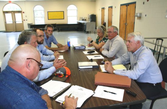 Laborers International Union of North America Local 630 representatives, Steward Jimmy Willis, Business Manager Ronnie Burris, attorney Andrew Bonderud and Steward Bruce Haley on the left negotiate with county Human Resources Director Jacqueline Martin, County Coordinator Wilbur Dean and county labor attorney Wayne Helsby.