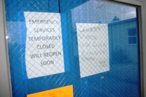 These two notices indicating the emergency room would reopen were never torn down when the owners vacated the property.