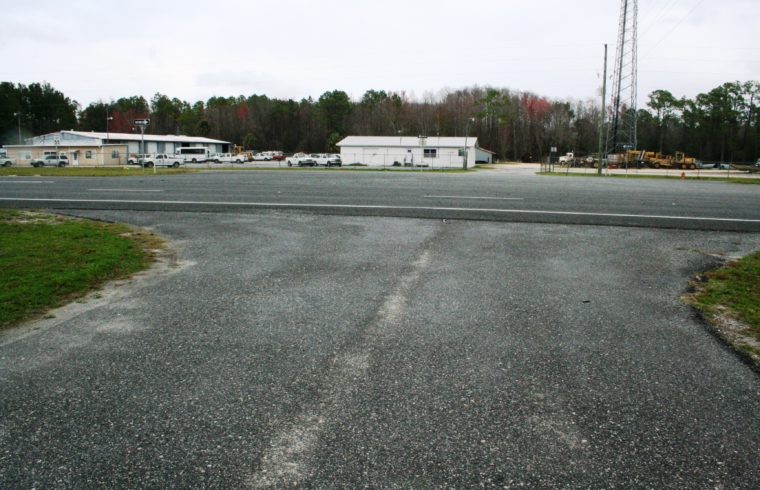 Bronson was given permission Tuesday by the Levy County Commission and Florida Department of Transportation to use this driveway at the Agriculture Extension Center for the new fire house. The Levy County Road Department can be seen on the opposite side of U.S. 27A. Photo by Terry Witt.