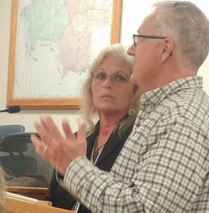 Florida Department of Transportation Engineer Cindy Dunkle of the DOT office in Chiefland is joined by Levy County Agricultural Extension Director Ed Jennings in discussing during the regular meeting of the Board of County Commission in discussing Bronson's plan for joint use of the northern agriculture entry driveway by Bronson Fire Rescue during regular meeting of the Board of County Commission. Photo by Linda Cooper.