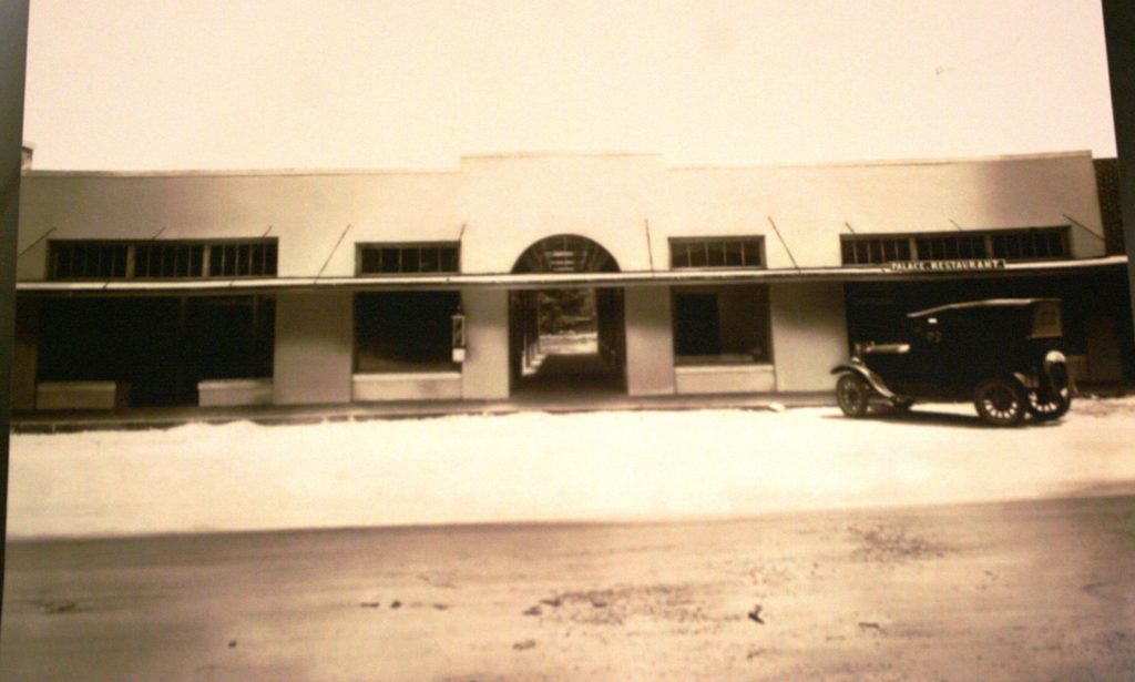 This 1920's era photo of Block 12 shows a Model T parked in front of the building.