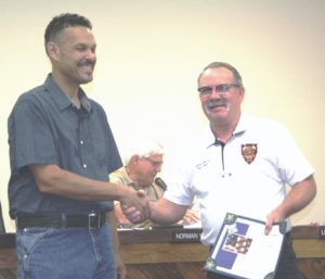 Fire Chief James Harris accepted his 10-year certificate from Mayor Chris Jones.