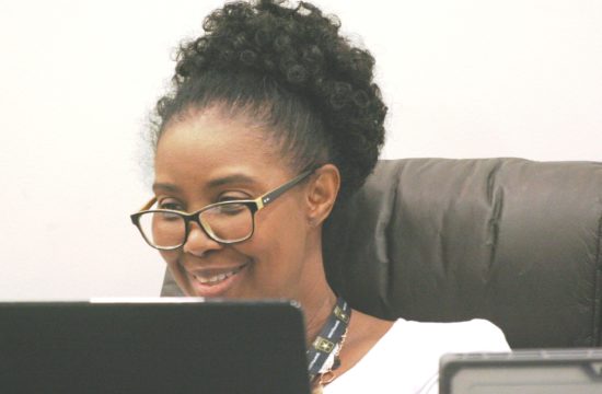 Williston City Clerk Latricia Wright smiles after a favorable job review.