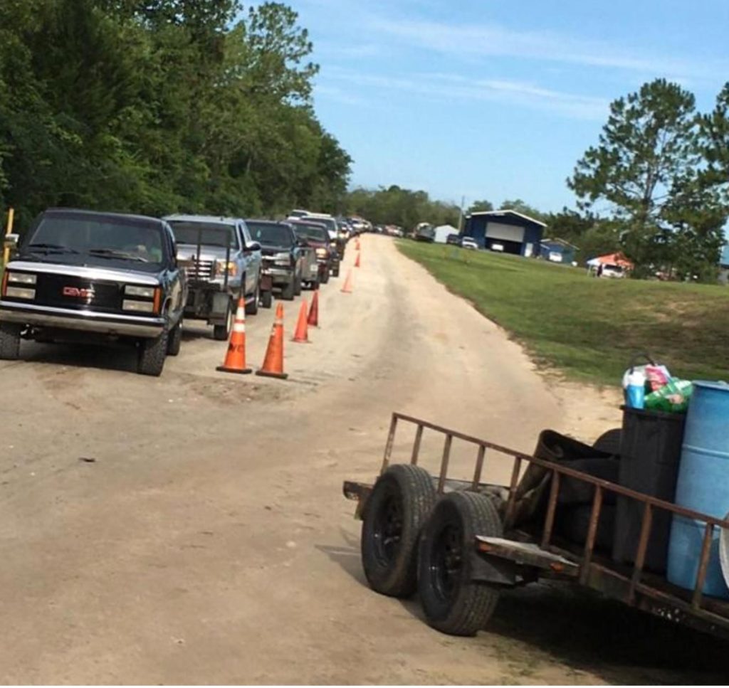 A line of trucks stretched from the landfill down the entire entrance road as people waited for their turn to get rid of their used tires