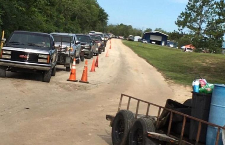 A line of trucks stretched from the landfill down the entire entrance road as people waited for their turn to get rid of their used tires