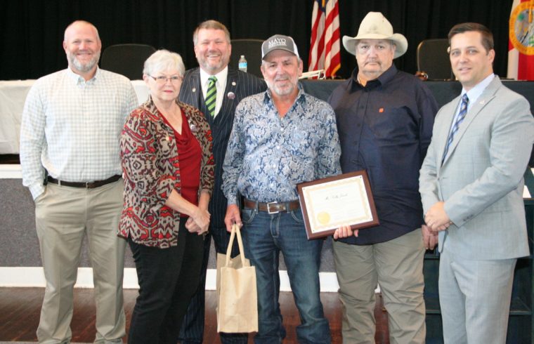 . Levy County Commissioners Rock Meeks, Lilly Rooks, John Meeks, Mike Joyner and Commission Chairman Matt Brooks honor retiring Road Superintendent for his loyalty and dedication to the county.