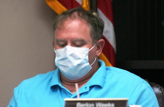 Bronson Councilman Berlon Weeks, wearing a face mask spoke Tuesday night about the need to halt stop-sign running at the intersection of County Road 32 and 337.