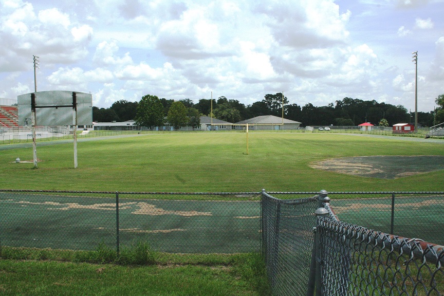 In the near future, an entrance driveway and exit driveway will be constructed at this end of the WMHS track. School buses carrying Joyce Bullock Elementary School children will enter and exit the stadium on this end of the facility. Buses will use the track like a driveway to drop off and pick up JBES students at the other end of the track.