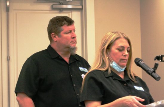 Waste Pro Community Marketer Dayna Miller addresses the Williston City Council as Waste Pro Division Manager Trip Lancaster listens.