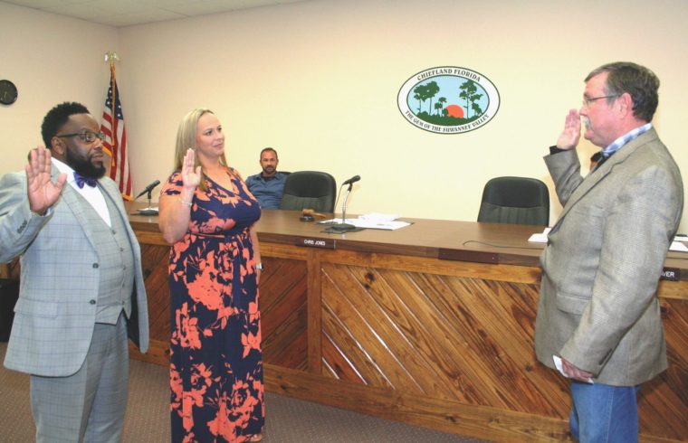 County Judge James T. Browning swears Lance Hayes and Lewrissa Mainwaring in as Chiefland city commissioners.