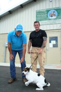 The spotted dog was found along a road in the Fanning Springs area. She is with Animal Services Director David Weatherford and Animal Services Officer Nathan Mercer.