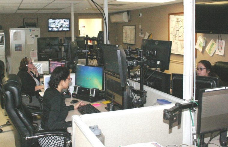 Dispatchers in the Levy County Sheriff's Office 911 Communications Center sit at banks of computers accepting emergency communications and responding.