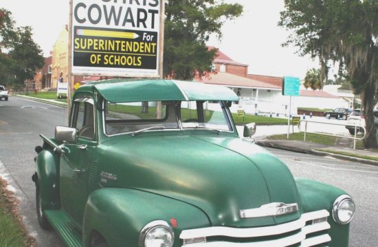 Chris Cowart, candidate for superintendent of schools, parked his 1951 Chevy pickup near election headquarters. The photo was taken after voting hours, hence no voters standing in line for early voting.