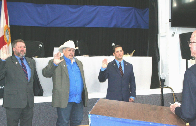 Levy County Commissioners John Meeks, Mike Joyner and Matt Brooks are sworn into office by retired County Judge Joe Smith.