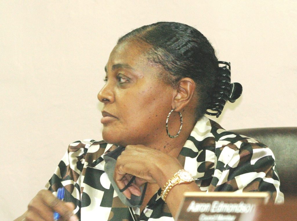 Mayor Beatrice Roberts turns to stare at Berlon Weeks as he takes his seat behind the council desk. She said he is no longer a member of the council.