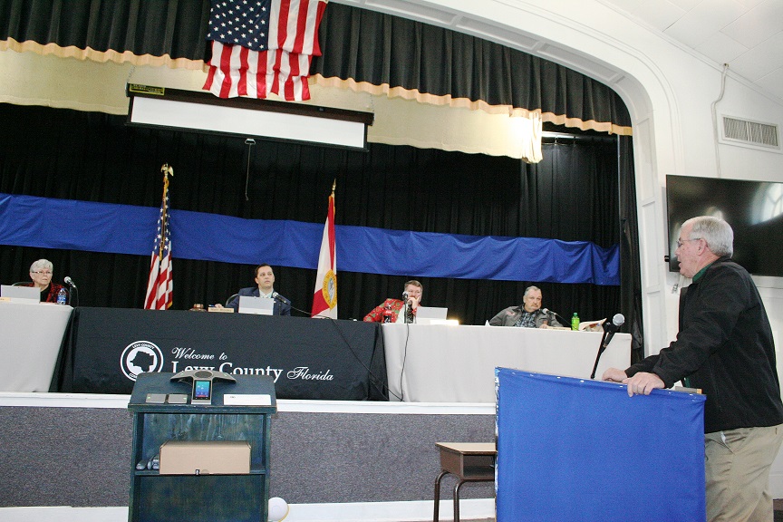 County Coordinator Wilbur Dean tells Commissioner Lilly Rooks, Commission Chairman Matt Brooks, Commissioner John Meeks, and Commissioner Mike Joyner he is crafting a policy that describes an unwritten pay raise practice that has gone on for years. Not pictured is Commissioner Rock Meeks, John Meeks was chosen as chairman and Joyner as vice-chairman in the meeting. Meeks voted against his appointment to the chairmanship.