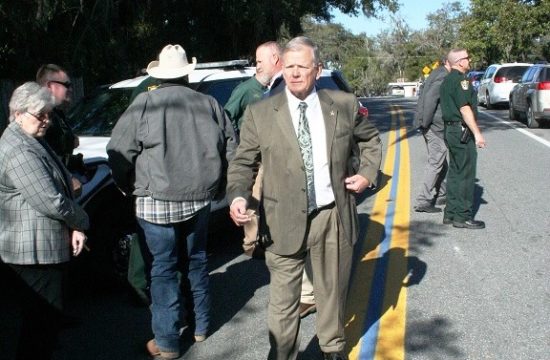 Sheriff Bobby McCallum walks along the thin blue line on Court Street Tuesday after a ceremony honoring law enforcement.