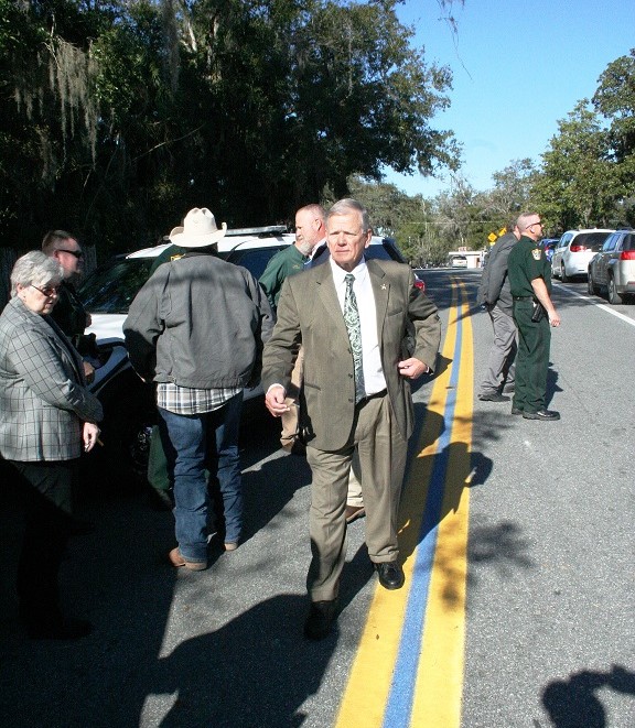 Sheriff Bobby McCallum walks along the thin blue line on Court Street Tuesday after a ceremony honoring law enforcement.