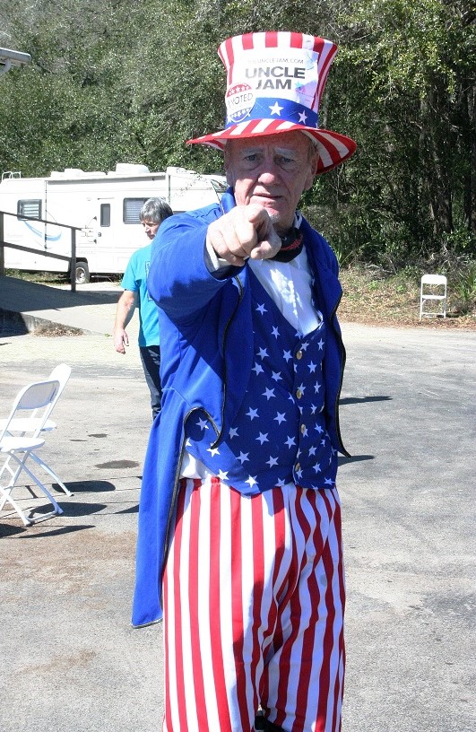 Duane Schwingel, dressed as Uncle Jam, sang tunes in the parking lot of the Williston Gun Show. One song said "Let's all vote again. I can't wait till we vote again with pen and paper and photo ID in our hand, I can't wait till we vote again." His satirical lyrics poked fun at the irregularities in the 2020 presidential election.