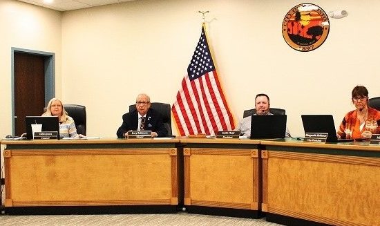 Williston City Council members prepare themselves for a recent board meeting. Pictured are Elihu Ross, Debra Jones, Mayor Jerry Robinson, Council President Justin Head, Marguerite Robinson and Michael Cox. Head did not seek re-election.