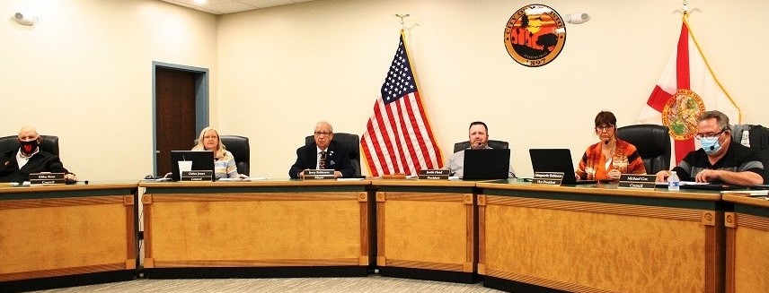 Williston City Council members prepare themselves for a recent board meeting. Pictured are Elihu Ross, Debra Jones, Mayor Jerry Robinson, Council President Justin Head, Marguerite Robinson and Michael Cox. Head did not seek re-election.