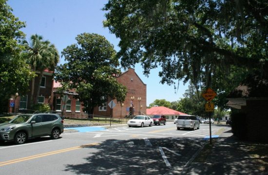 Court Street in front of the Levy County Courthouse was busy Monday afternoon when this photo was taken. Picnic Street intersects with Court Street opposite the blue painted area.