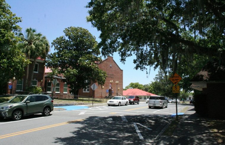 Court Street in front of the Levy County Courthouse was busy Monday afternoon when this photo was taken. Picnic Street intersects with Court Street opposite the blue painted area.