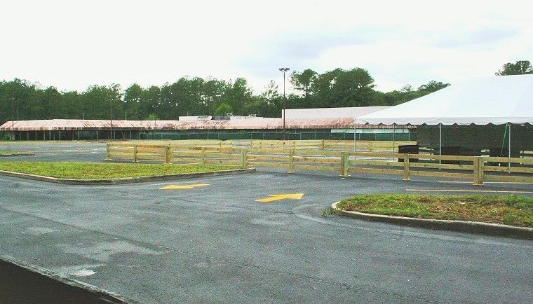 A large portion of the old Winn Dixie parking lot off State Road 121 in Williston has been resurfaced. Trees have been trimmed. The tent at the right is for visitors to meet company officials this weekend and ask questions about the future attraction planned for the site. The company is planning to revamp the property.