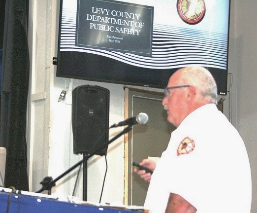 Department of Public Safety Director Mitch Harrell presents county commissioners with his request to approve the hiring of three full-time firefighters in Morriston.