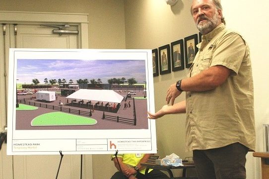 Homestead Tiny House CEO Matt Crandell shows a computer-aided rendering of what a portion of his future development will look like at the old Winn Dixie site.