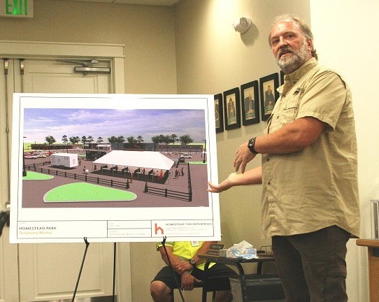 Homestead Tiny House CEO Matt Crandell shows a computer-aided rendering of what a portion of his future development will look like at the old Winn Dixie site.