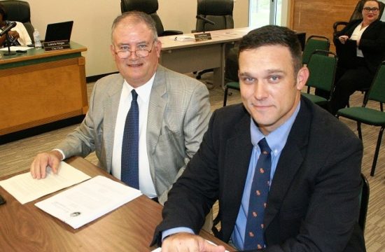 Attorneys Norm and Blake Fugate await the start of their interview. Blake Fugate would be Williston’s city attorney if the firm is hired on Tuesday.