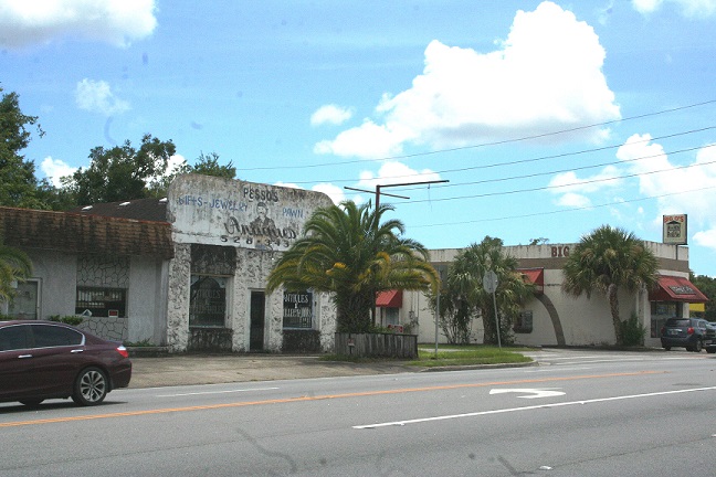 The former pawn shop, located next door to Big O's Package store, won't win any beauty contests. Big O's is grandfathered-in by the city.