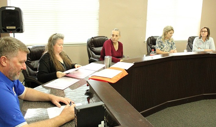 Bronson Canvassing Board members are County Commission Chairman John Meeks, Bronson Town Clerk Susan Beaudet, Bronson Deputy Clerk Wendy Maragh. They are being observed by Assistant Elections Supervisor Jordan Lindsey and Supervisor of Elections Tammy Jones.