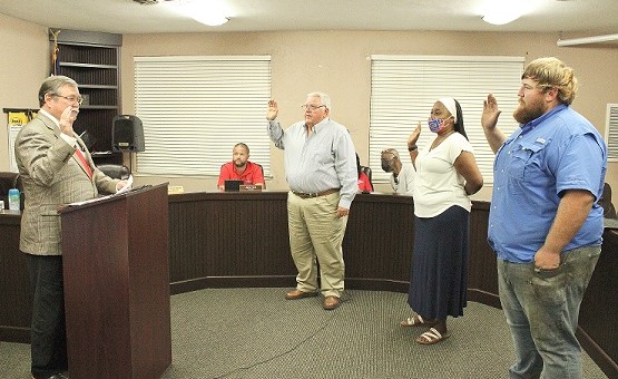 County Judge James T. Browning Swears in Council members Robert Partin, Sherrie Schuler, and Tyler Voorhees.