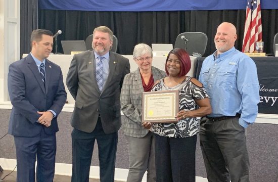 Photo by Alicia Tretheway Procurement Coordinator: Almarie Sheppard is honored by Levy County Commissioners Matt Brooks, Chairman John Meeks, Lilly Rooks and Rock Meeks for going above and beyond her duties at the landfill to report theft activities.