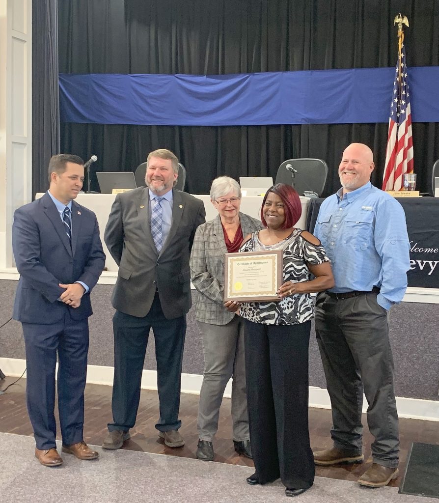 Photo by Alicia Tretheway Procurement Coordinator: Almarie Sheppard is honored by Levy County Commissioners Matt Brooks, Chairman John Meeks, Lilly Rooks and Rock Meeks for going above and beyond her duties at the landfill to report theft activities.