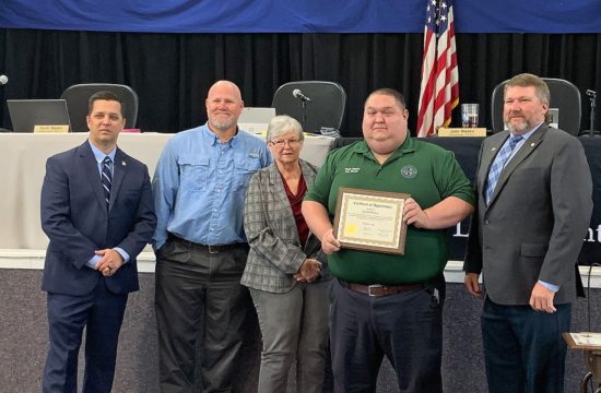 Photo by Alicia Tretheway Procurement Coordinator: Levy County Commissioners Matt Brooks, Rock Meeks, Lilly Rooks, Assistant Director of Emergency Management David Peaton, and Commission Chair John Meeks honor Peaton for his outstanding service to the county.