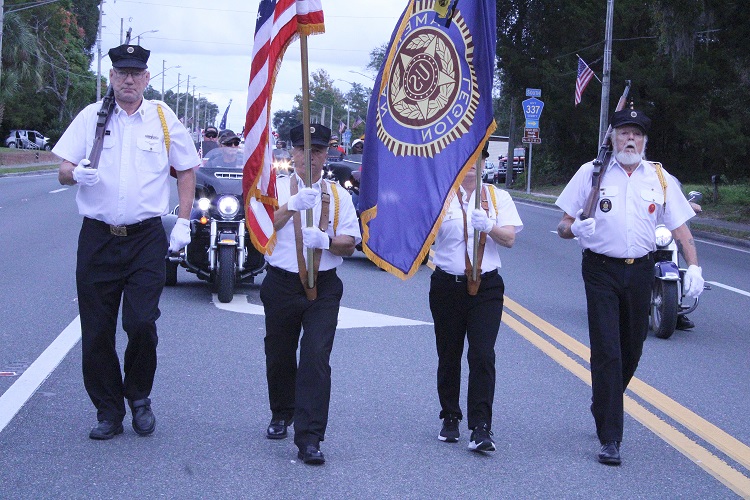 Bronson American Legion Post 236 officers march as the Honor Guard for the Levy County Veterans Day Parade Thursday.