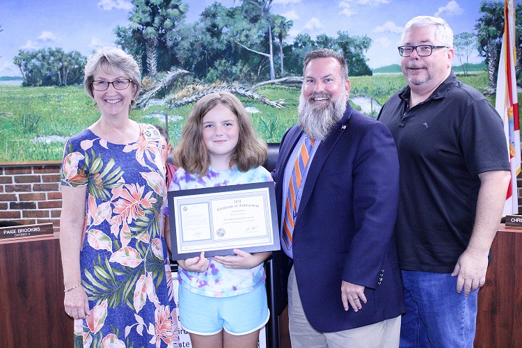 Bronson Elementary School student Madeline Garner is recognized for a perfect score on the Florida Standards Assessments last year. Shown from the left are Bronson Elementary School Principal Cheryl Beauchamp, Madeline Garner, School Superintendent Chris Cowart and School Board member Cameron Asbell.