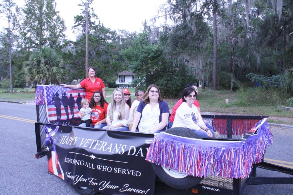 Levy County Tax Collector Michele Langford stands at the back of her patriotic float.