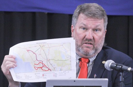 Levy County Commission Chairman John Meeks shows one of the route maps for the proposed Northern Turnpike Extension. He said the Florida Department of Transportation email announcing the latest attempt to build a toll road through Levy County caught the board off guard.