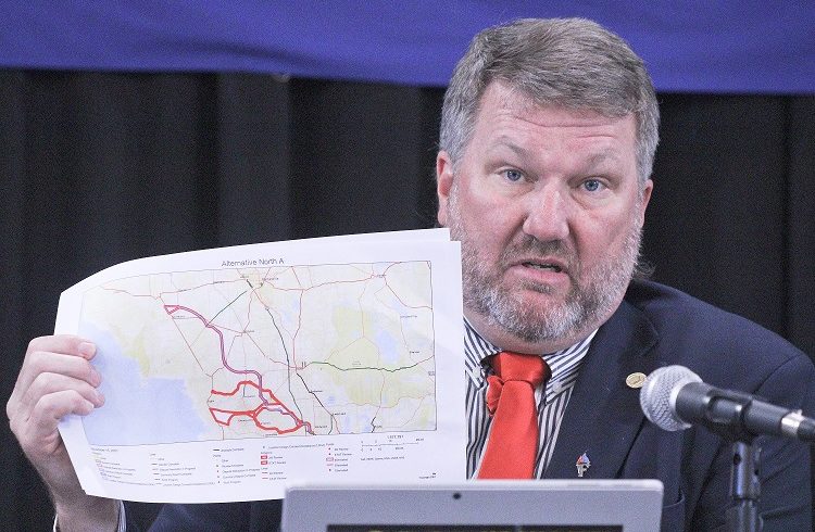 Levy County Commission Chairman John Meeks shows one of the route maps for the proposed Northern Turnpike Extension. He said the Florida Department of Transportation email announcing the latest attempt to build a toll road through Levy County caught the board off guard.