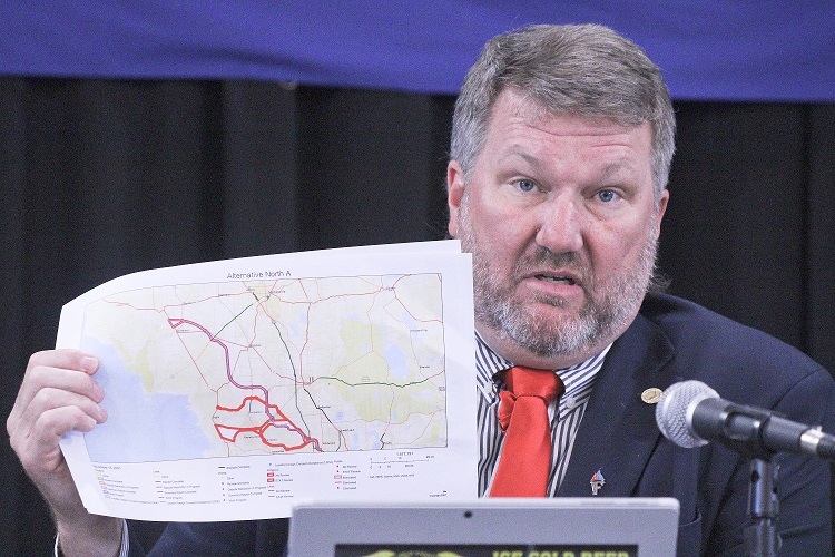 Levy County Commission Chairman John Meeks shows one of the route maps for the proposed Northern Turnpike Extension. He said the Florida Department of Transportation email announcing the latest attempt to build a toll road through Levy County caught the board off guard.