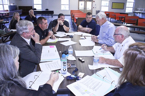 Union leaders meet with county government officials for a contract bargaining session. From the lower left, County Human Resource Director Jacqueline Martin, County Coordinator Wilbur Dean, IAFF Union President Ryan Tietjen, union officials Jimmy Willis and Shawn Holcomb, county Labor Attorney Wayne Helsby, Public Safety Director Mitch Harrell, and Alesha Rinaudo, administrator at the Department of Public Safety.