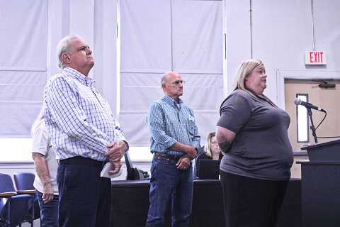 Levy Arc Executive Director Lisa Daniels stands with her board officers at this week's Levy County Commission meeting. The officers from left are Board President Randy Stefanelli, Board Secretary Carol Seamon (mostly hidden), and Board Treasurer Charlie Smith.