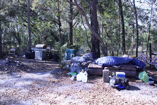 The junk and trash-filled lot at 418 N. Pine St. looked like this on Saturday, March 5, 2022.