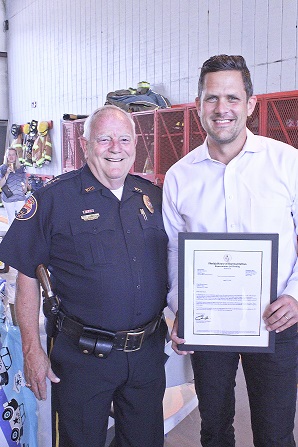 State Rep. Joe Harding presents Strow with a Florida House of Representatives certificate honoring his half-century of service in law enforcement.